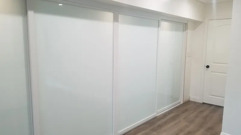 ER II white glass sliding glass closet door