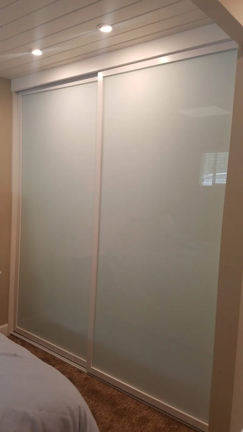 ER II white glass sliding glass closet door
