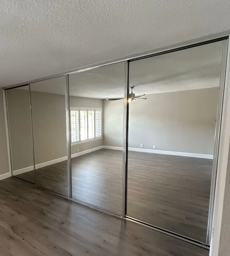 Open channel mirrored closet door