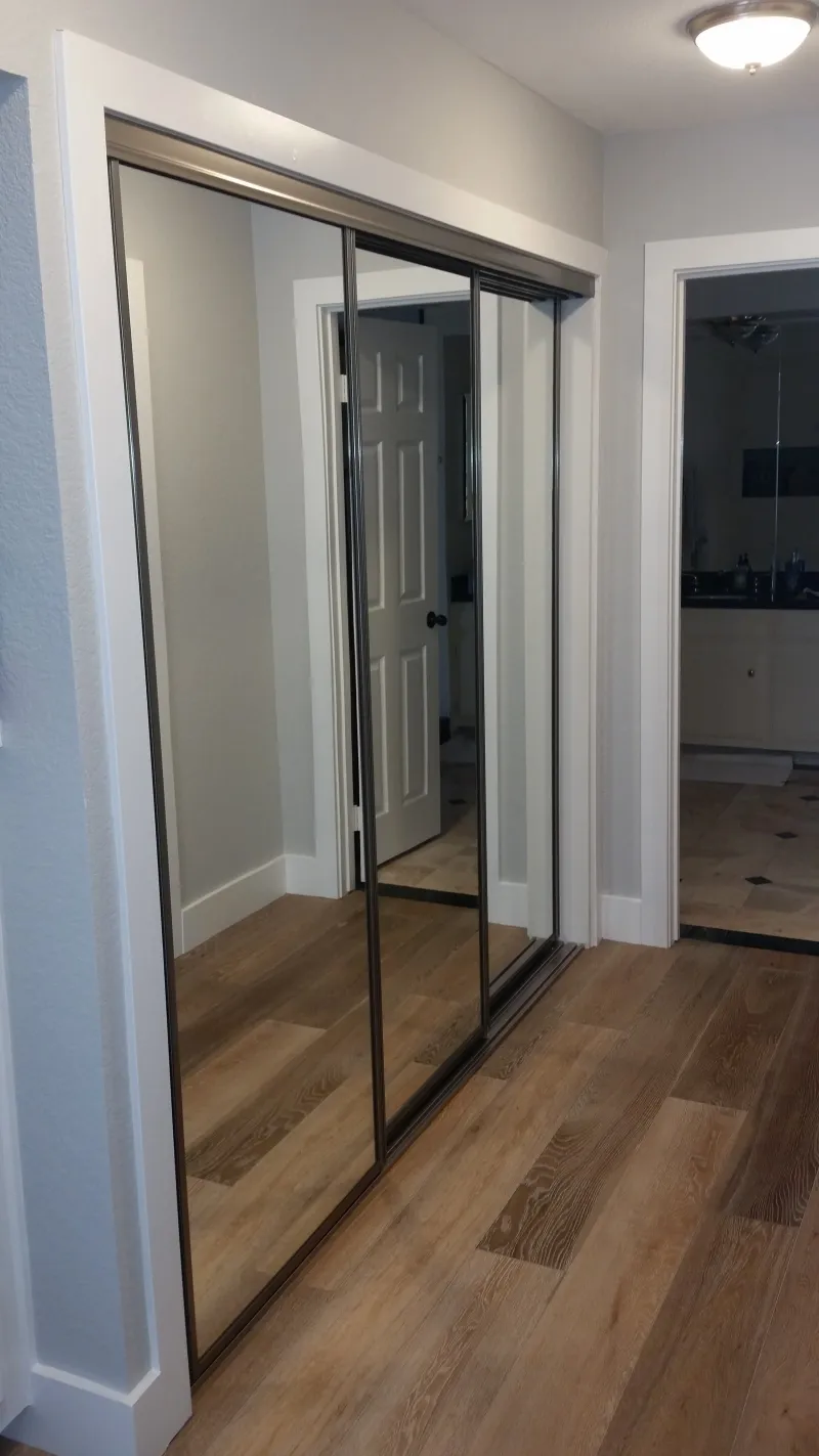 Open channel mirrored closet door