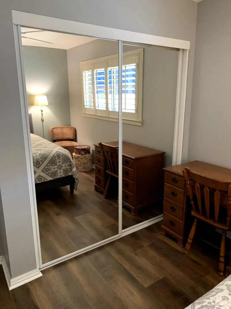 Open channel mirrored closet door