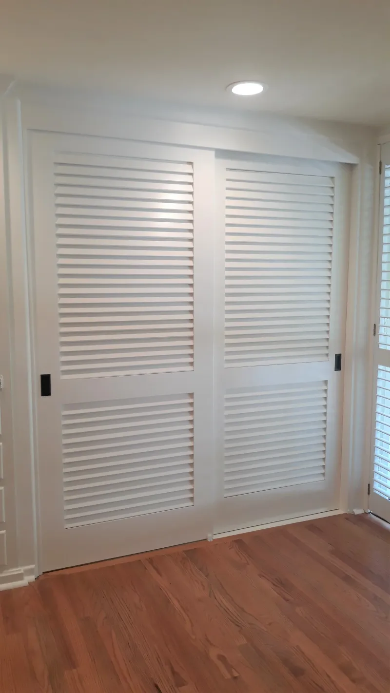 Louver over louver sliding closet door