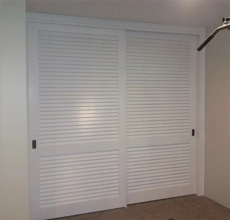 Louver over louver sliding closet door