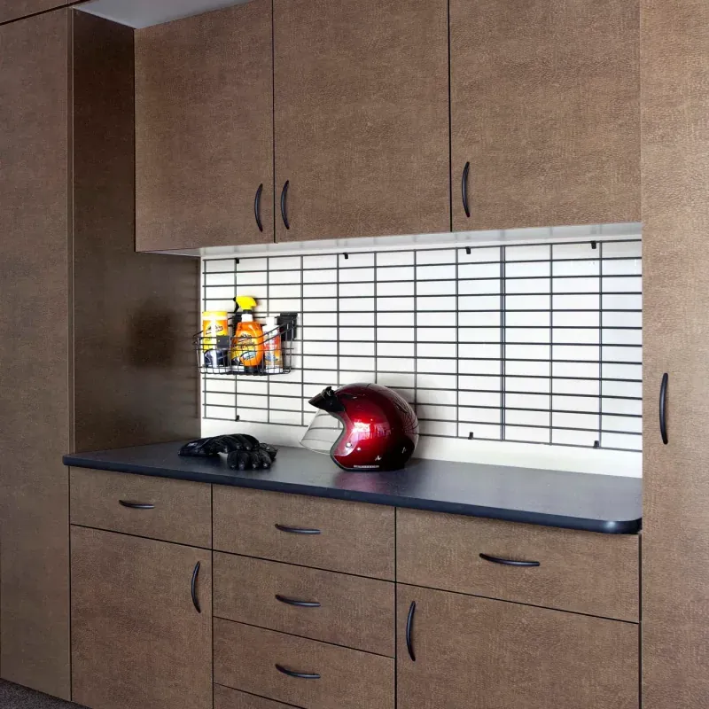 Custom garage storage — bronze cabinets inset ebony star