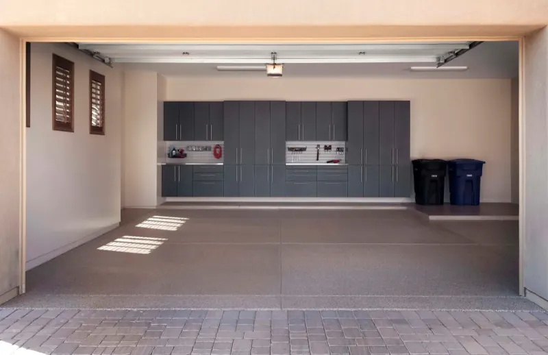 Custom garage storage — granite cabinets double stainless workbench