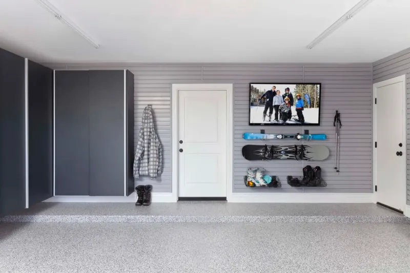 Custom garage storage — granite cabinets grey slatwall ski