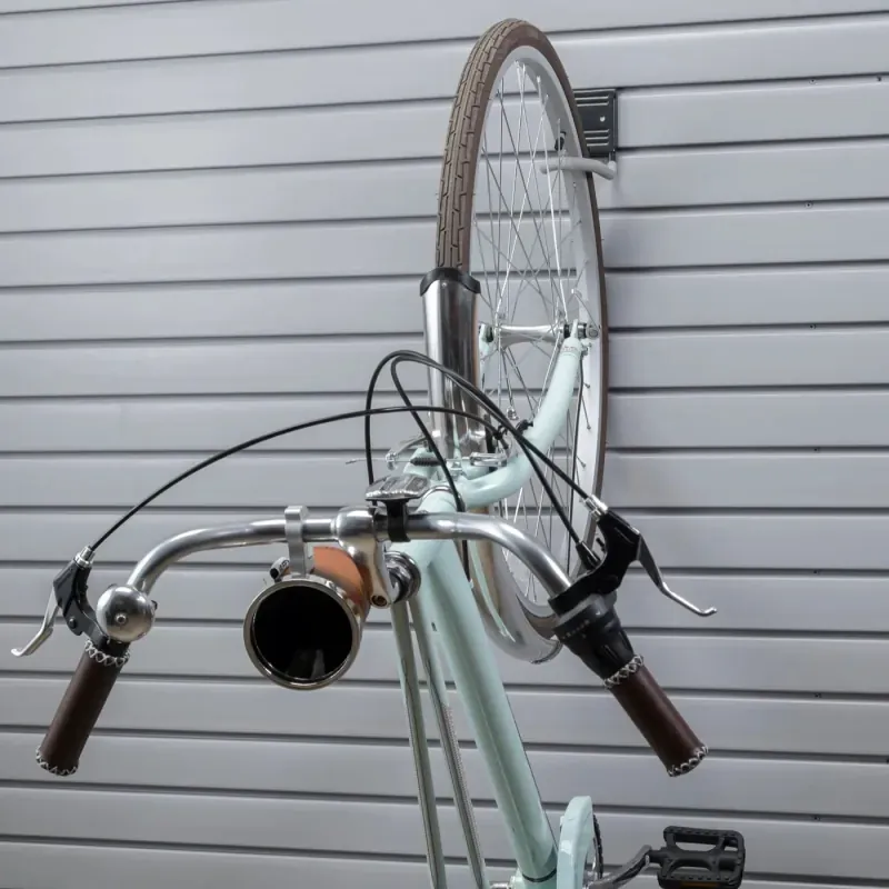 Bike storage hook mounted on a garage slatwall system