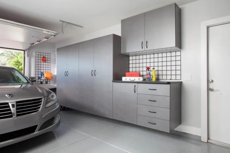 Custom garage storage — pewter cabinets workbench grey car