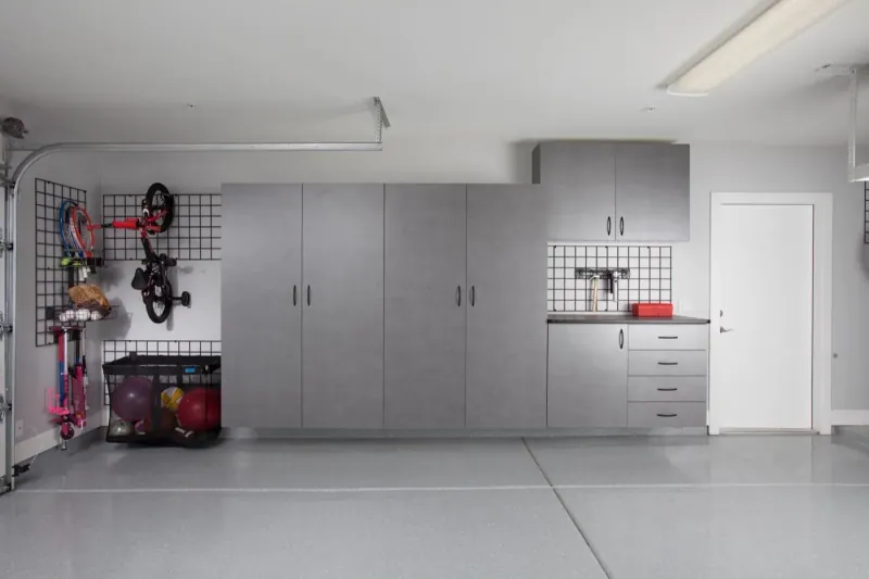 Custom garage storage — pewter workbench gridwall kid bikes