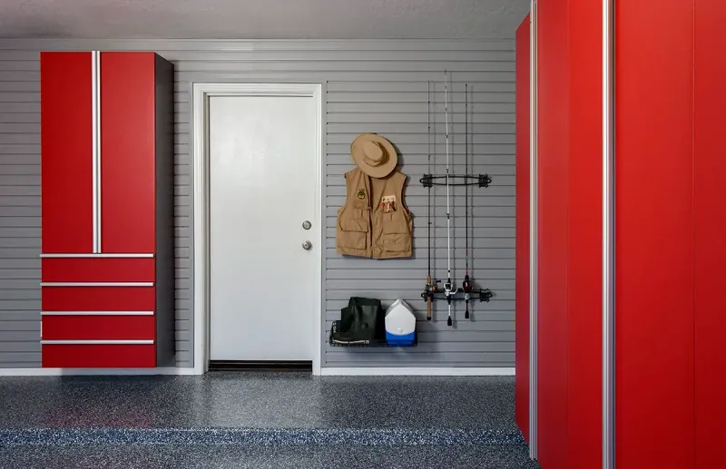 Custom garage storage — red cabinets fishing rods grey
