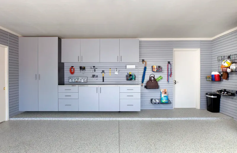 Custom garage storage — silver cabinets stainless counter grey
