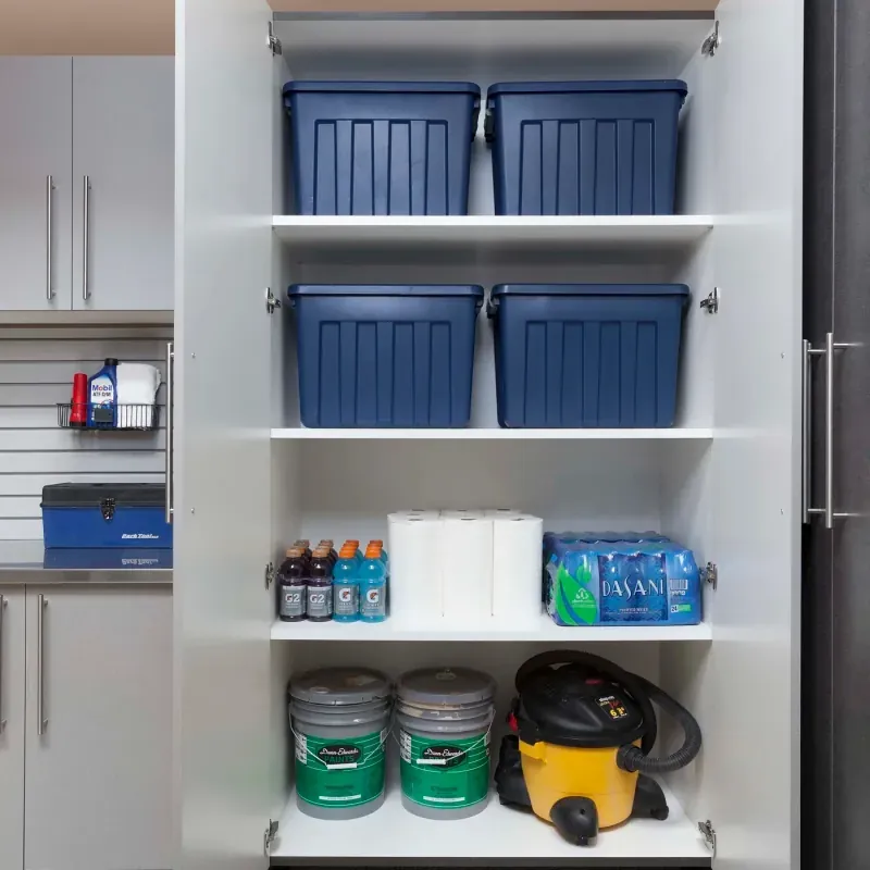 Custom garage storage — tall silver cabinets smoke