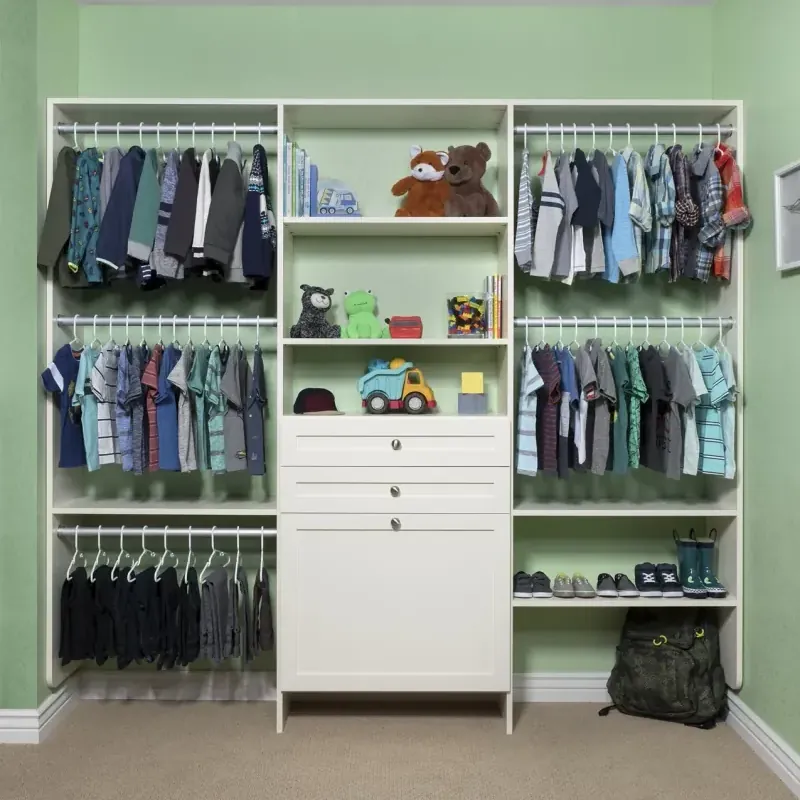 Antique white shaker reach-in closet designed for a toddler's room, with open shelving and hanging storage