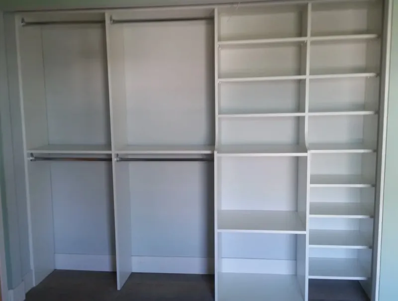 Reach-in closet with double hanging rods and open shelving