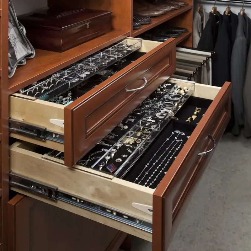 Walk-in closet in warm cognac finish with open jewelry organizer drawers