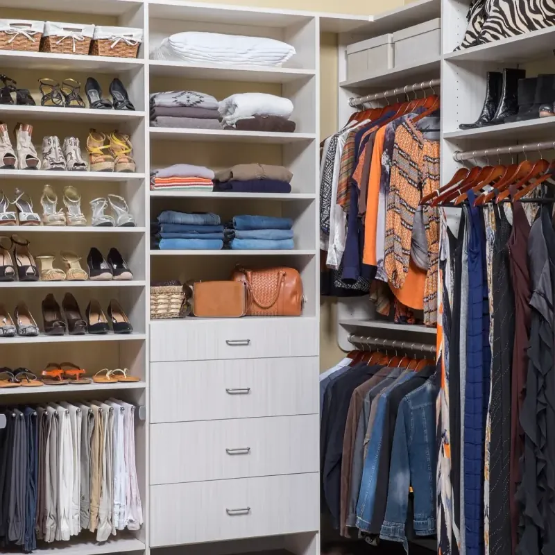 Arctic white flat-panel walk-in closet in a compact layout