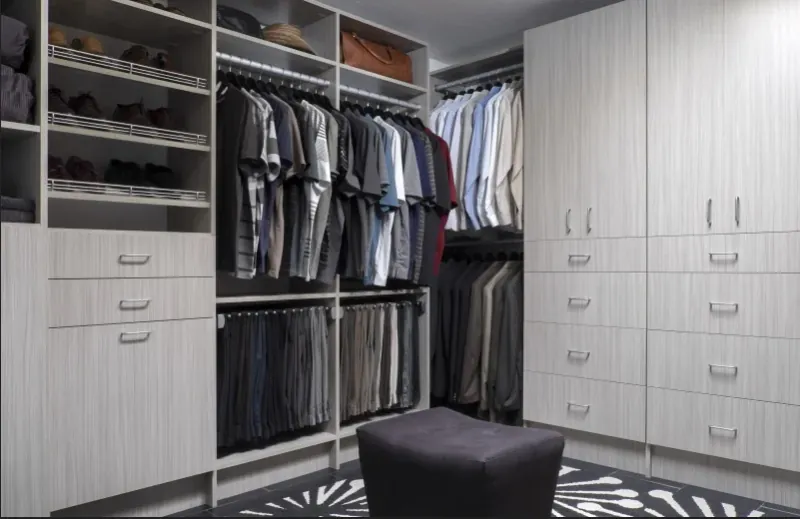 Arctic finish walk-in closet designed for a men's wardrobe