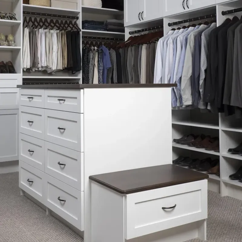 White shaker walk-in closet with center island bench in coco finish