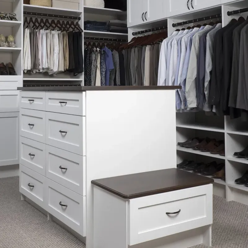 White shaker walk-in closet with center island bench and double hanging